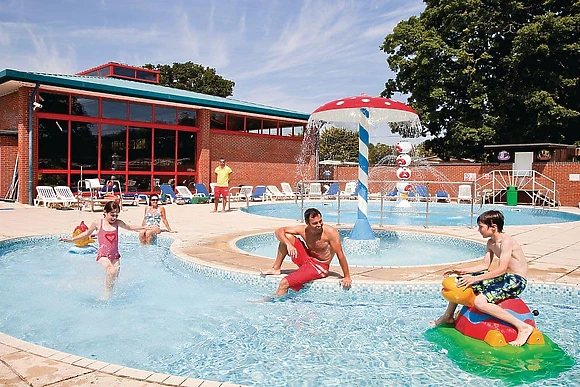 Outdoor swimming pool with water jets